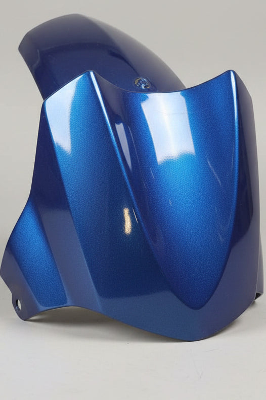 Blue motorcycle fender on a red background