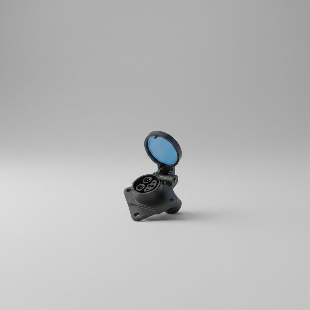 Hand holding a black electrical connector against a neutral background
