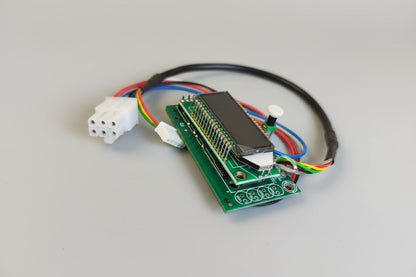 Electronic circuit board with connectors on a red fabric background