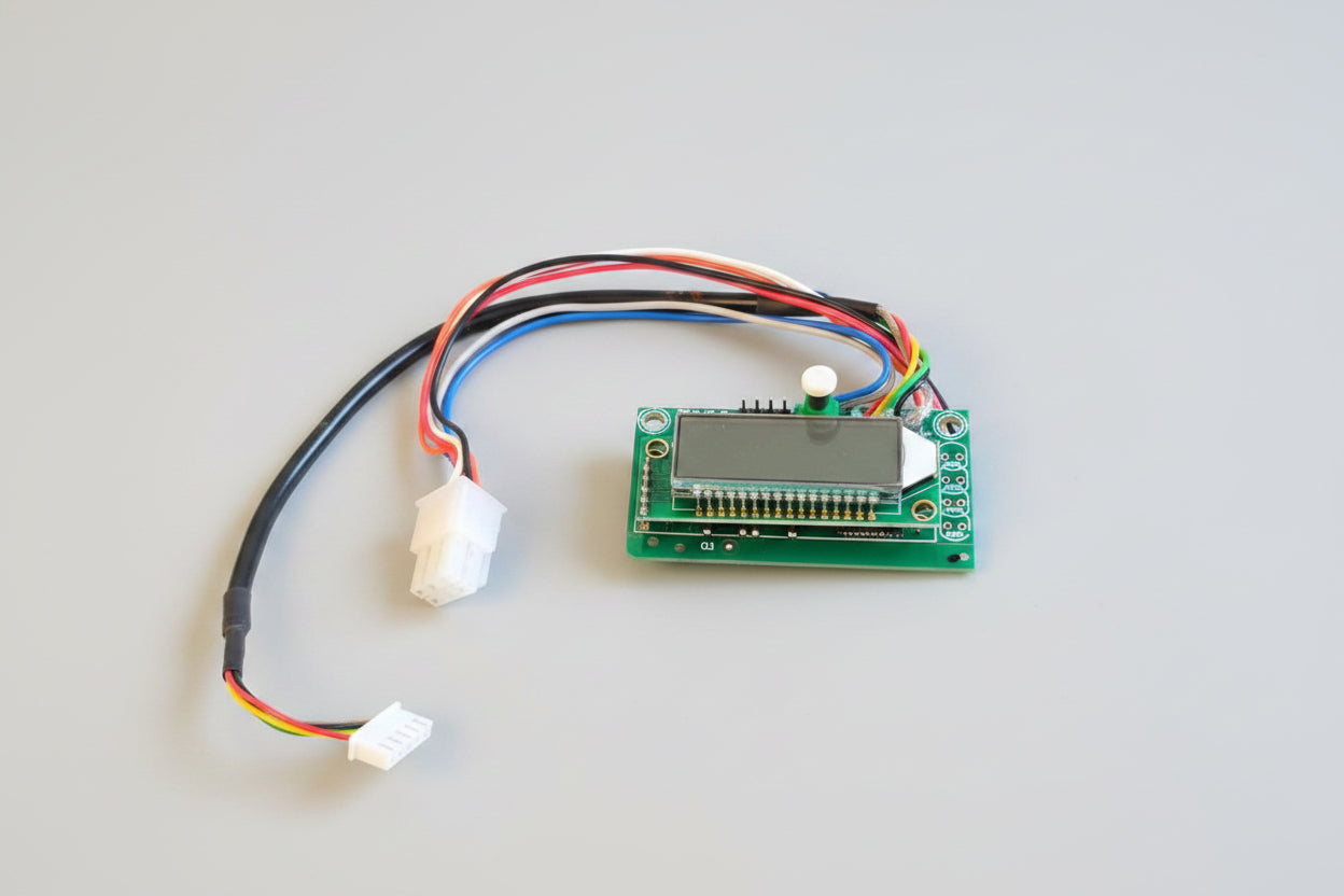 Electronic circuit board with wires on a red fabric background