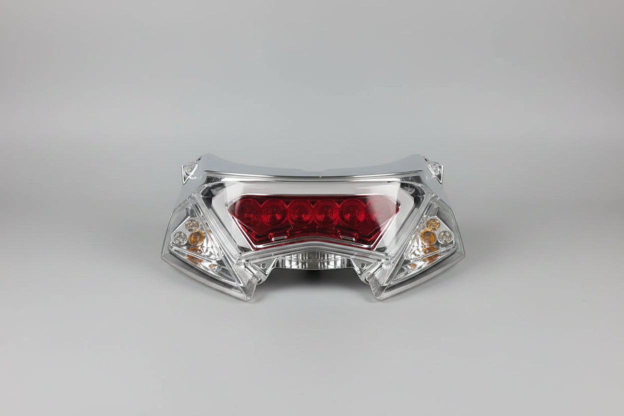 Motorcycle headlight on a red stand with a blurred background