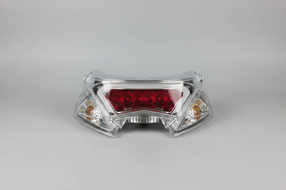 Motorcycle headlight on a red stand with a blurred background
