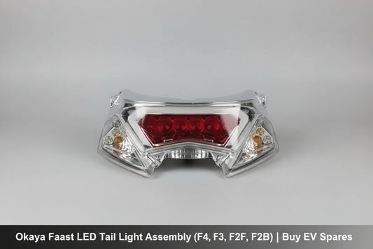 Motorcycle headlight on a red stand with a blurred background