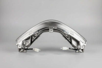 Car headlight assembly on a red and white fabric background