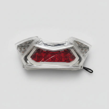 Clear plastic container with red contents on a light-colored floor.
