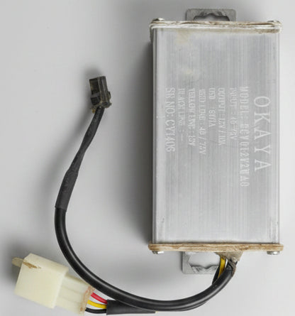 Battery with wires on a dark textured surface