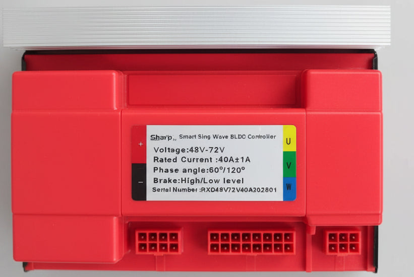 A red industrial electronic module with a white label reading 'Eaton Smart Busway BLC Controller' and a stack of white terminal strips placed beside it on a dark surface.